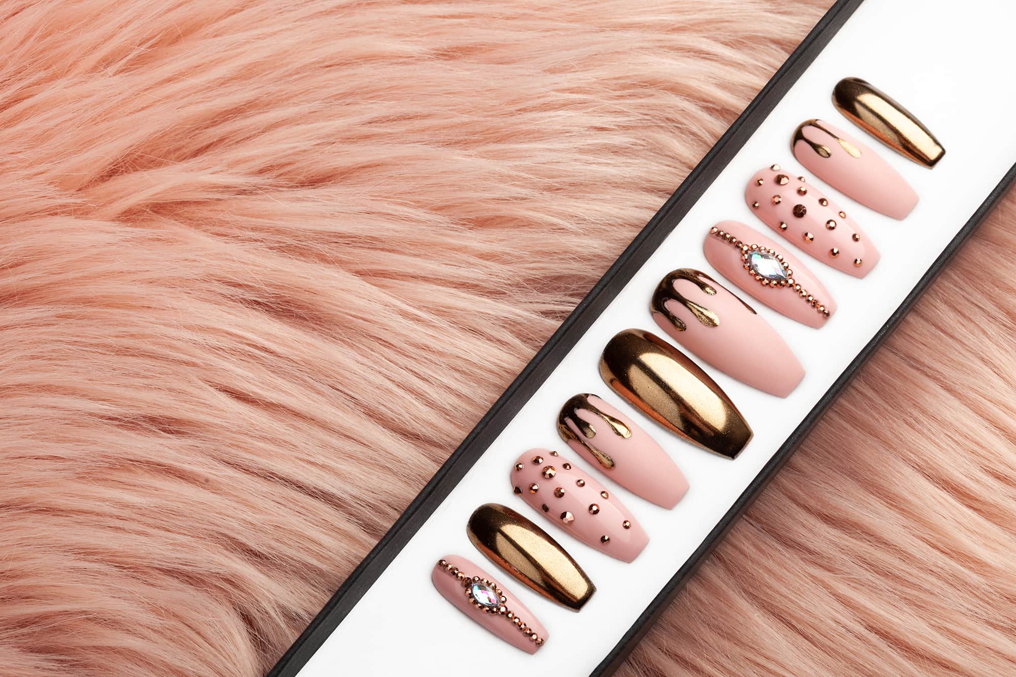 Rose gold press on nails with drips and Swarovski rhinestones
